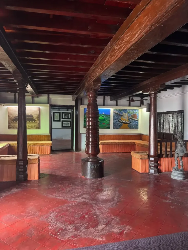 View of a spacious hall in the Arakkal Museum, displaying cultural and historical exhibits from the Arakkal family.