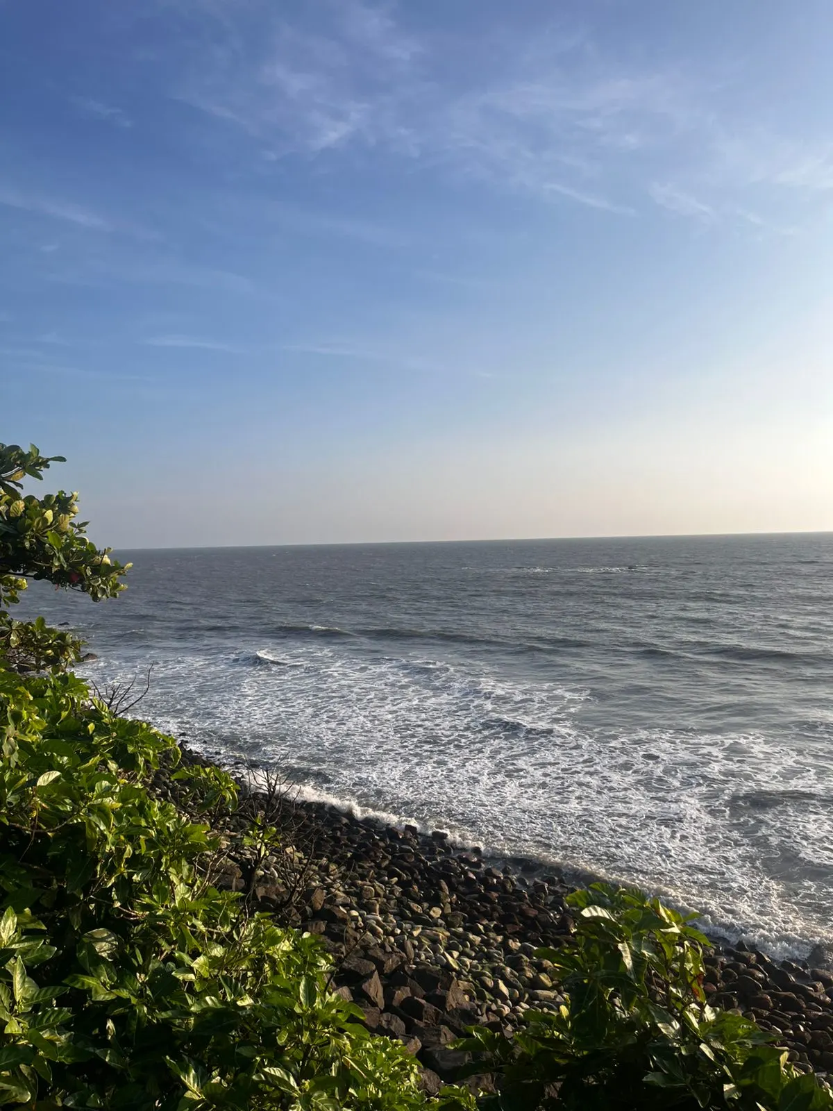 Walking promenade along Baby Beach in Kannur, offering a scenic view of the ocean
